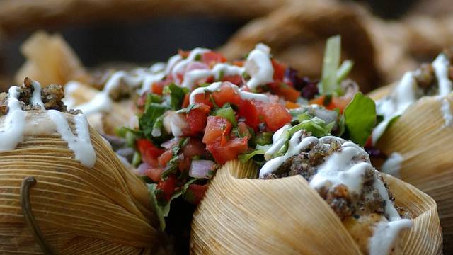 Reata Restaurant signature dishes Pecan Biscuits And Elk Sausage Gravy, Tenderloin Tamales With Pecan Mash, Bacon Wrapped Crab Stuffed Jalapeños, Southwestern Style Fish Tacos.